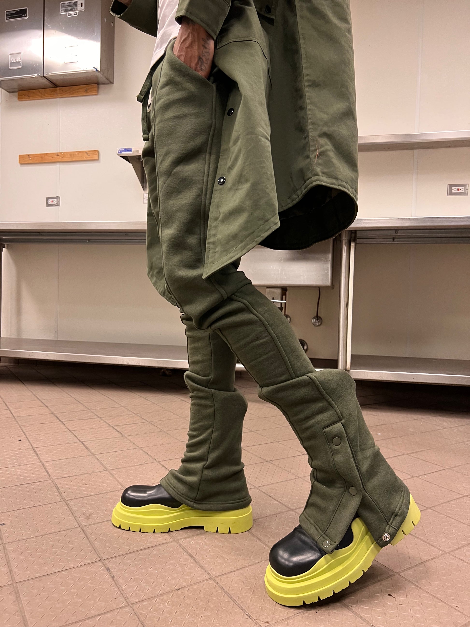 Side view of Green Stacked Joggers with adjustable snap-button lower legs