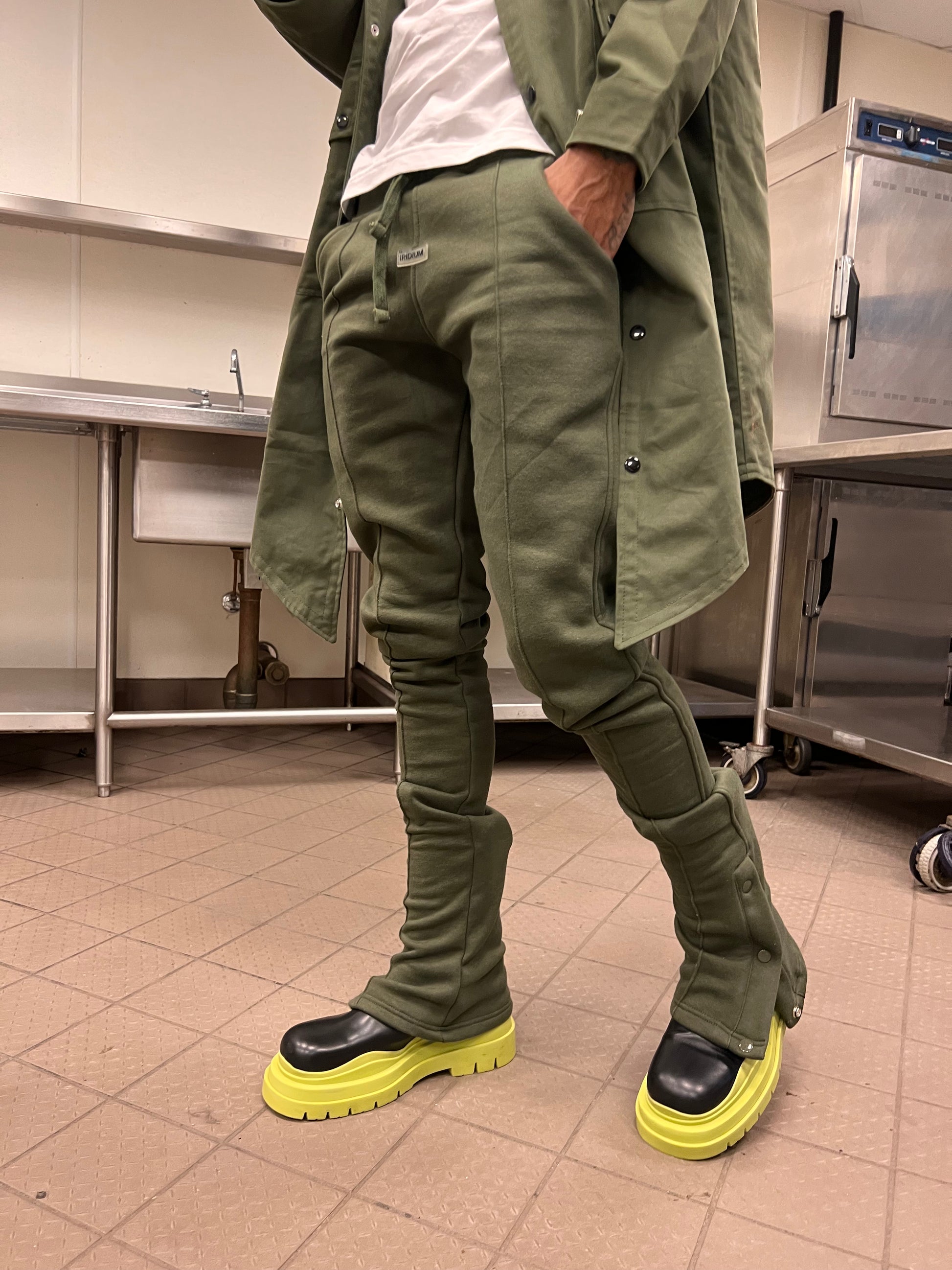 Front view of Green Stacked Joggers showing the extended stacked legs