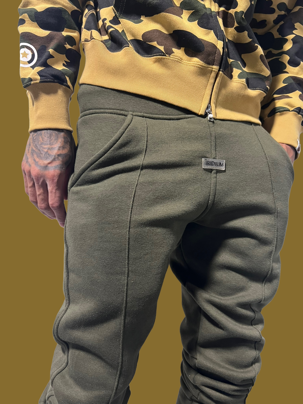 Close-up front view of the waistband and fabric on Green Stacked Joggers