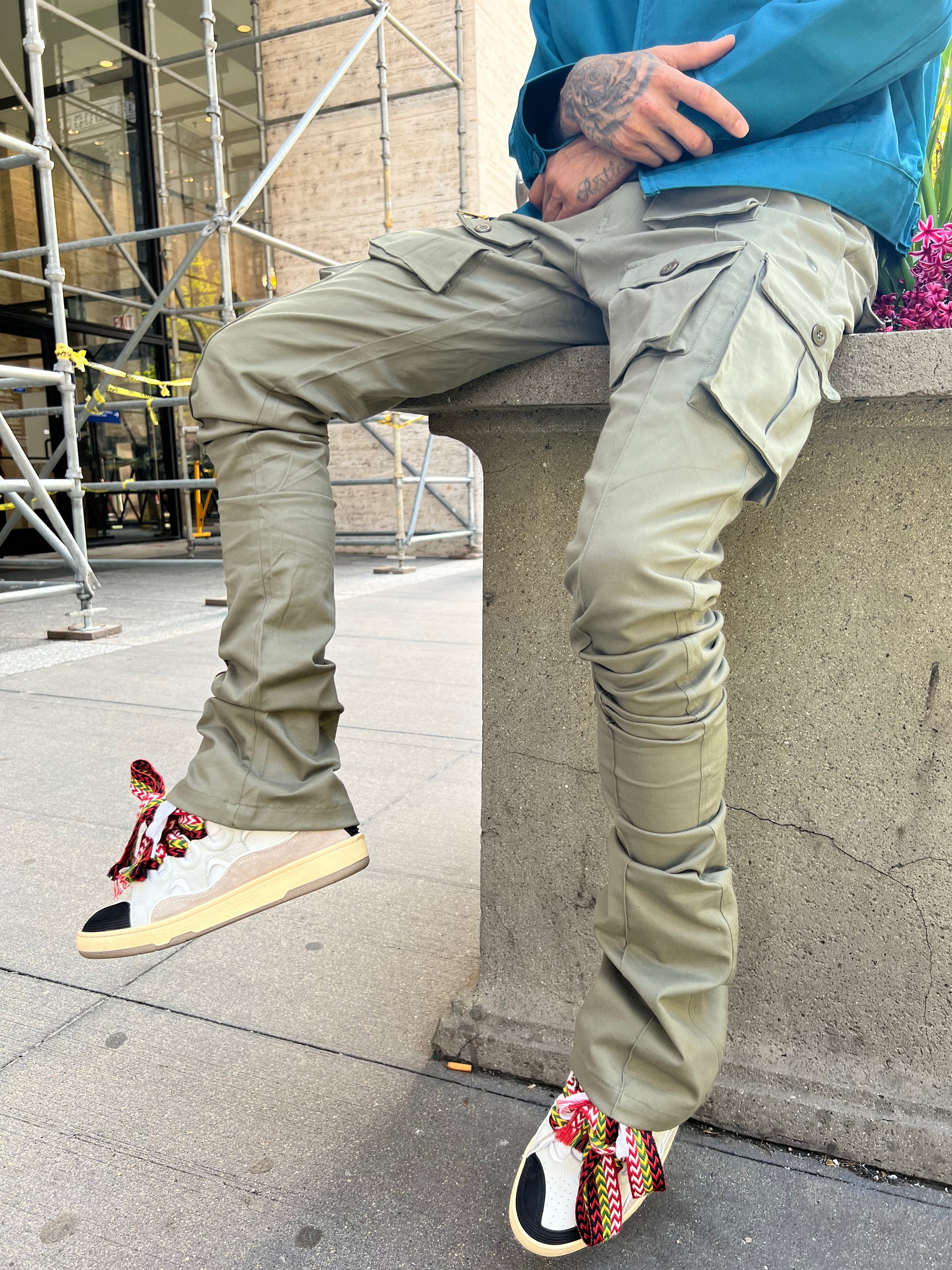 Close-up of the cargo pockets and stacked legs on the Green Stacked Cargo Pants